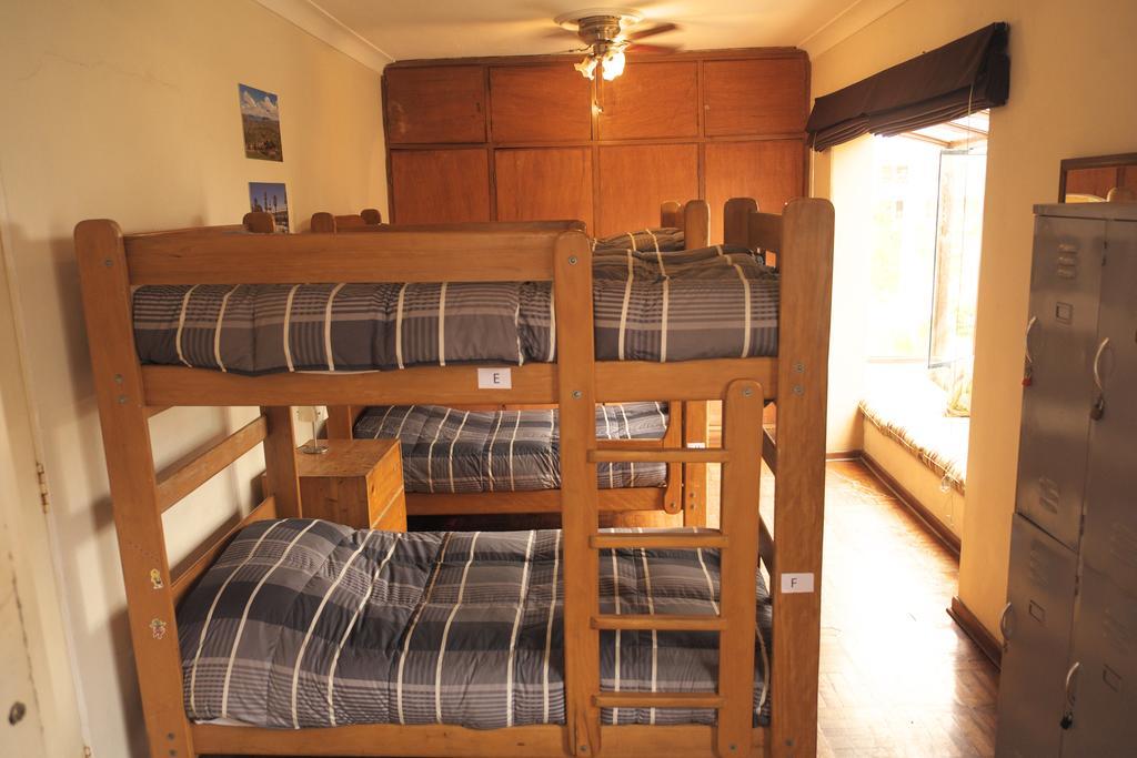 Cama en habitación compartida de 8 camas
